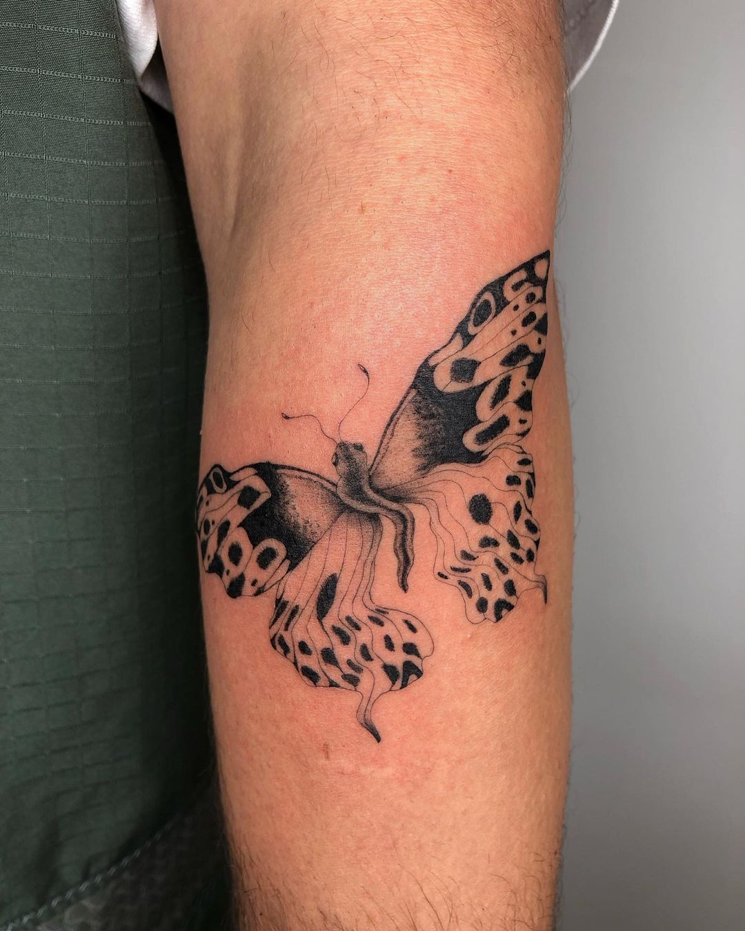 Traditional Black Butterfly Tattoo On Forearm