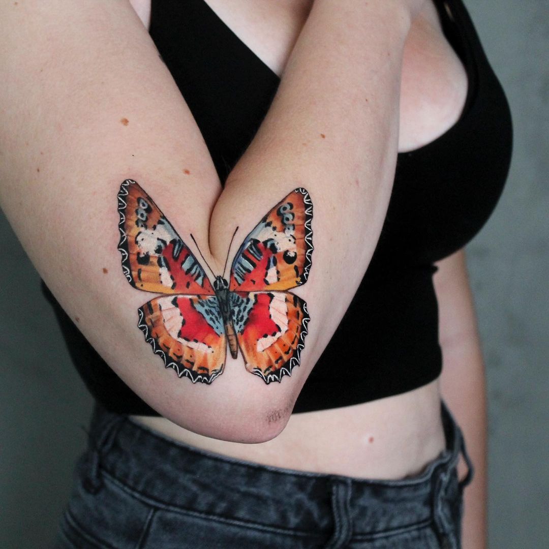 Vibrant Butterfly Elbow Tattoo