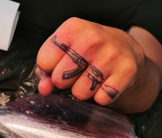 Ak 47 Gun Tattoo On Fingers