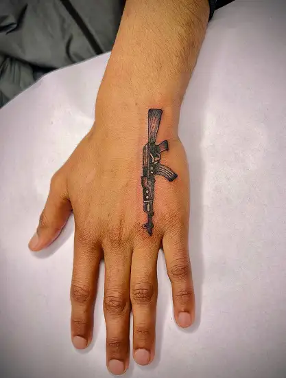 Gangster Gun Tattoo On Hand by samttsm  Tattoogridnet