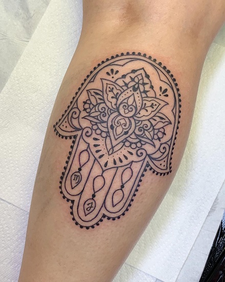Freehand Hamsa tattoo done on the thigh in watercolor