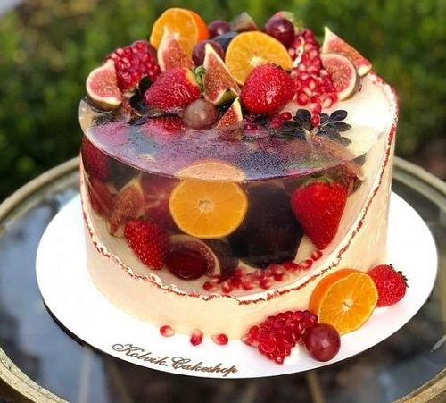 A beautiful fruit cake with a pink biscuit around it • wall stickers bakery  goods, food photography, receipe | myloview.com