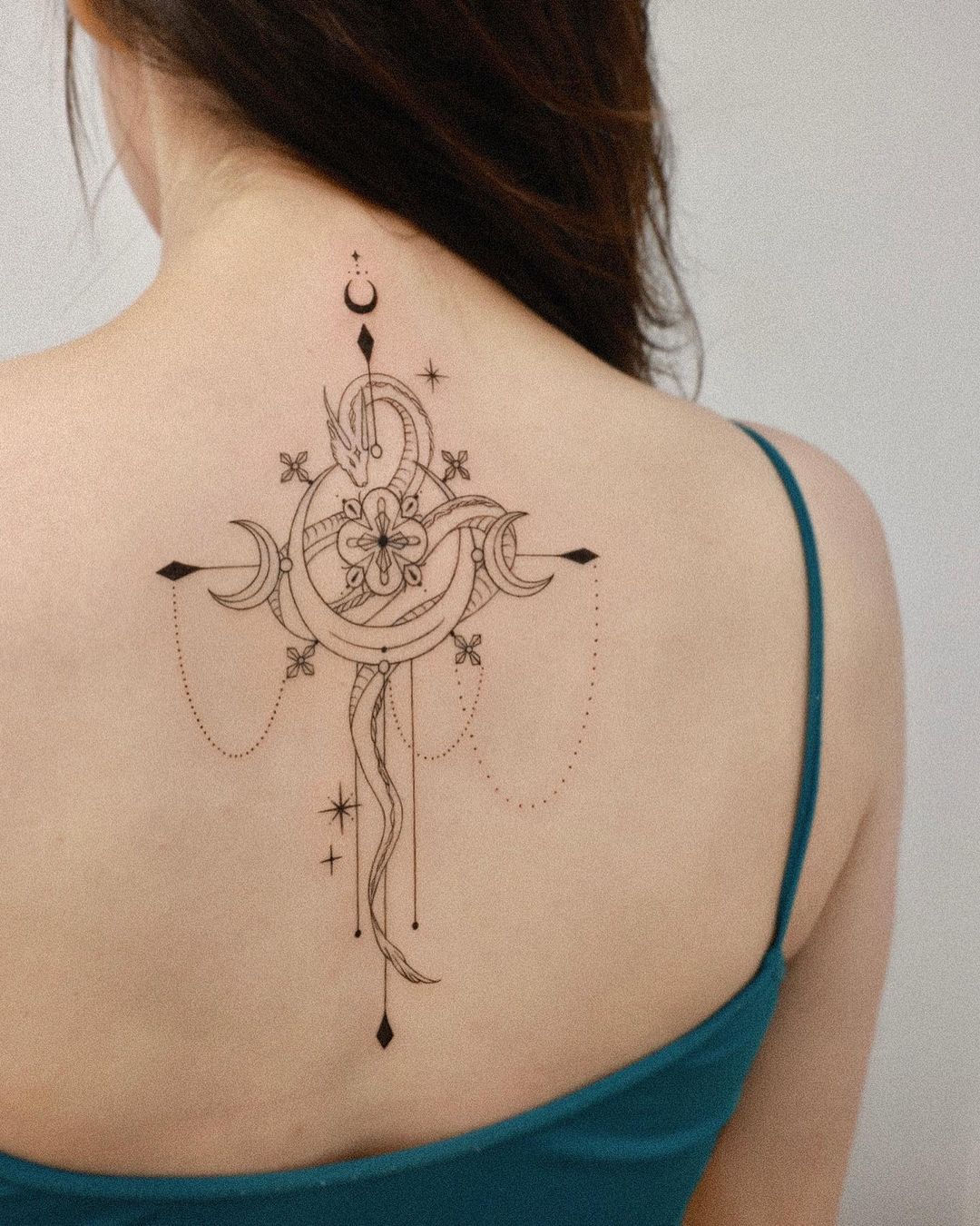 Ornate Celestial Cross Back Tattoo