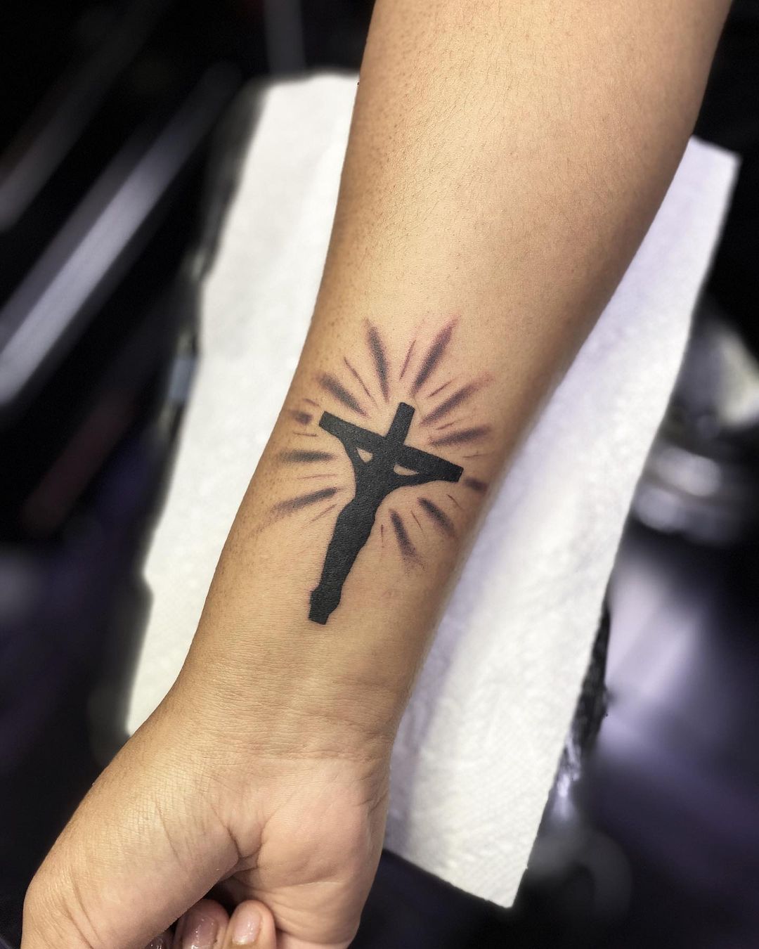 Radiant Christ On Cross Wrist Tattoo