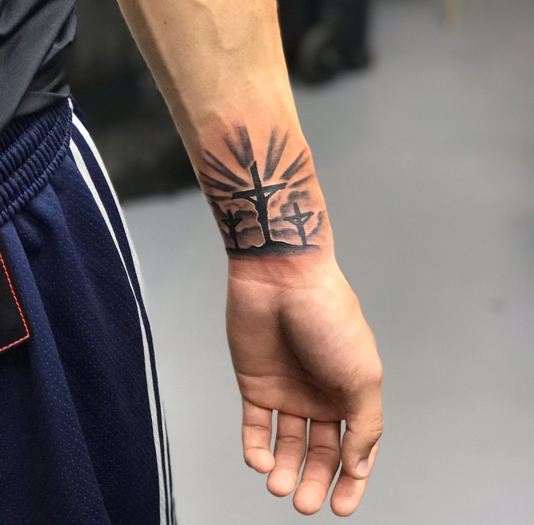Triple Radiant Cross Wrist Tattoos
