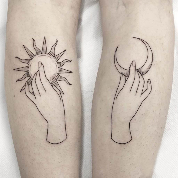 Hand Holding Sun And Moon Tattoo 10