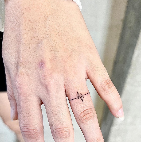 Small Heartbeat Finger Tattoo