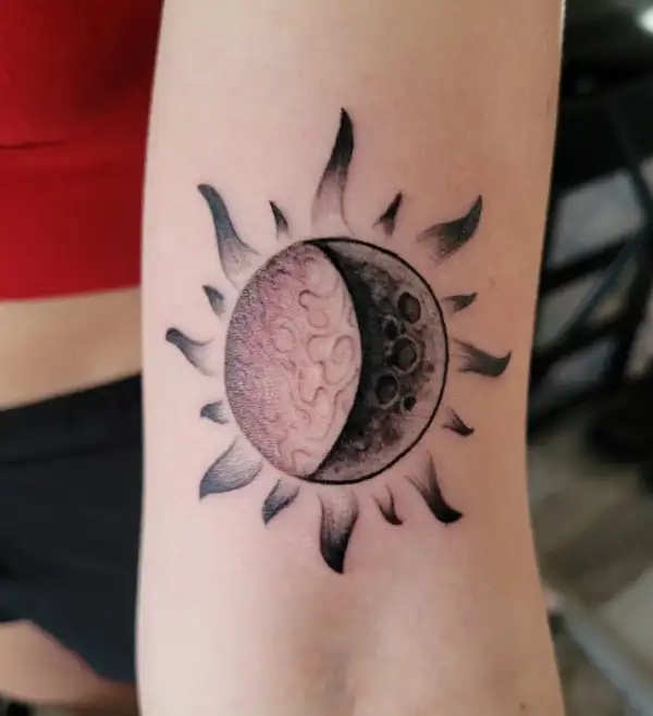 Sun moon and stars tattoo on the upper back