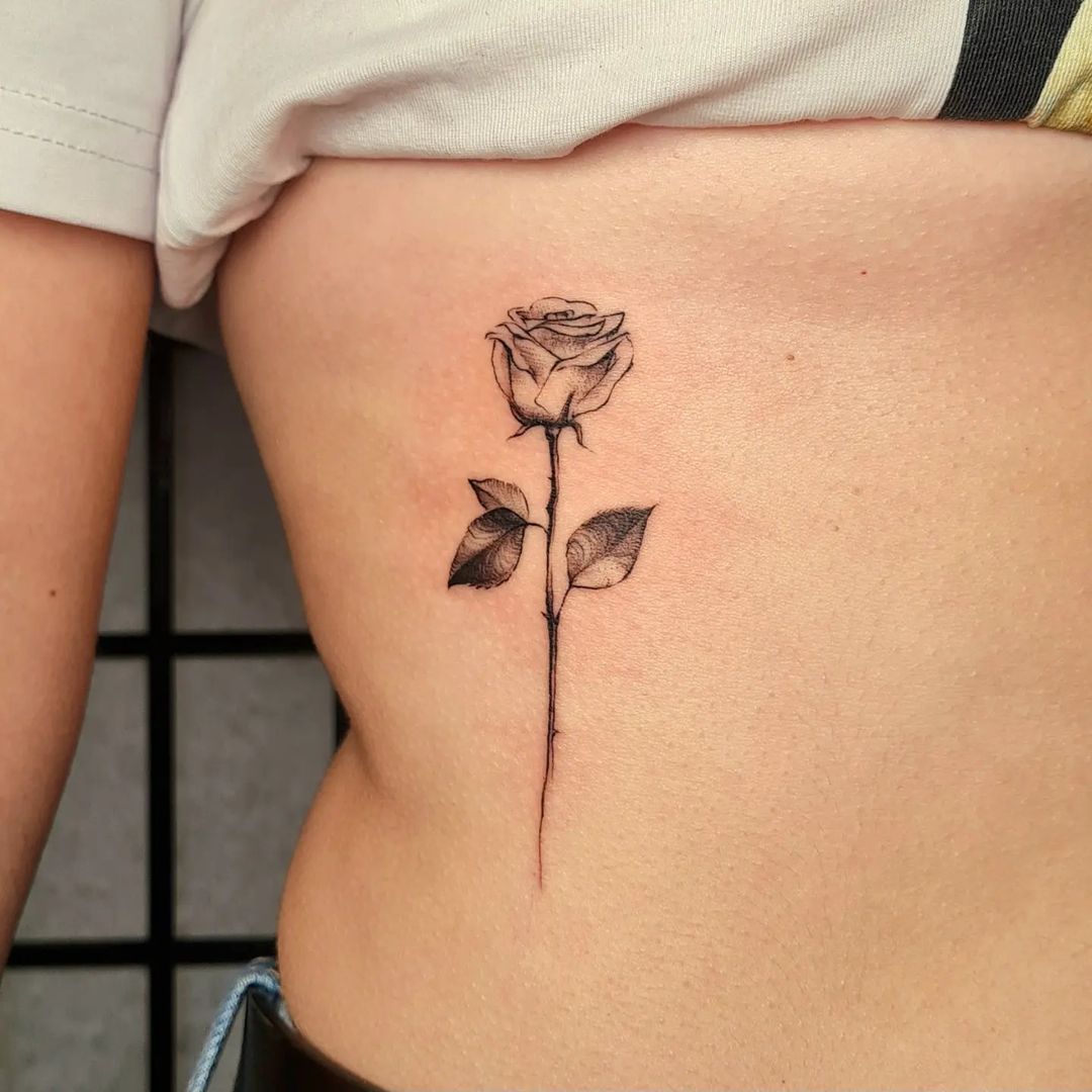 Rib Rose Tattoo In Fine Line