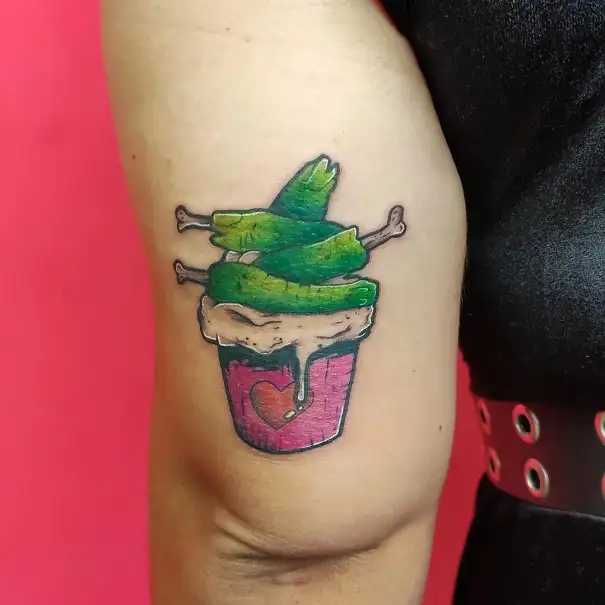 Chicken cupcake tattoo on hand.jpg