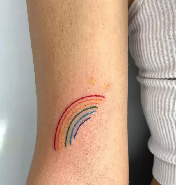 these rainbowcolored tattoos are like lisa frank on acid