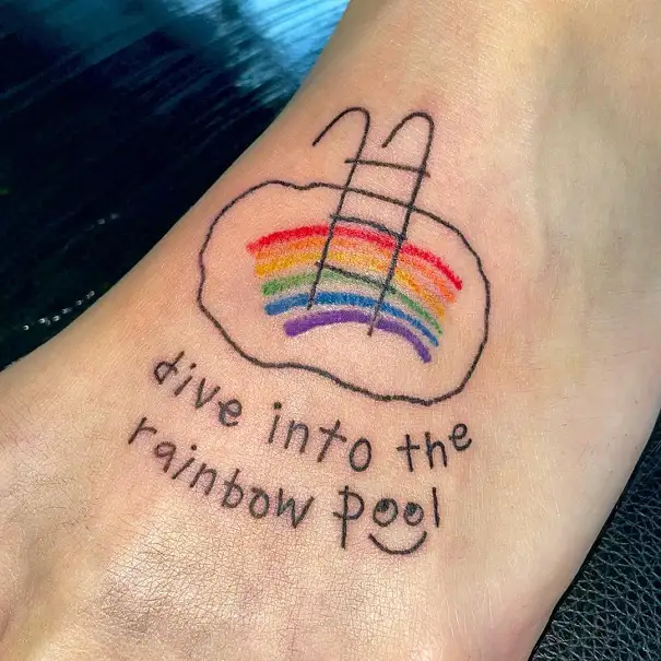Tiny rainbow tattoo on the right ear  Tattoogridnet