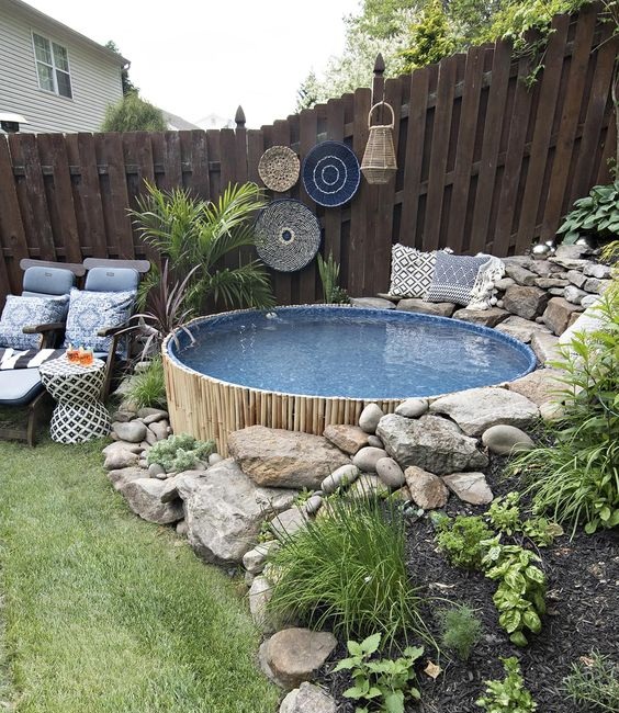 A Circular Above-ground Pool With Stone Décor