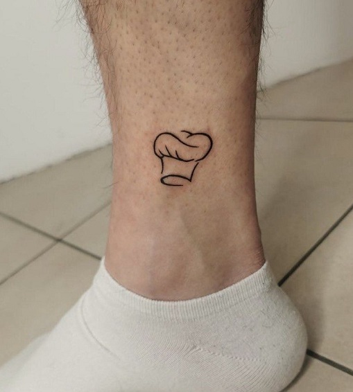 Tiny Chef Cap Tattoo On The Leg