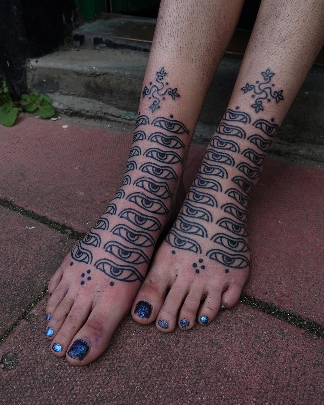 Eyes On Foot Tribal Tattoo