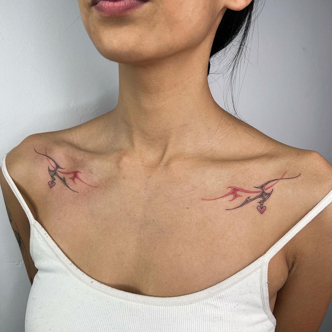 Stylised Wings With A Heart Tribal Shoulder Tattoo