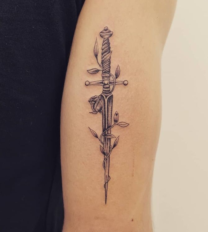 Hand-poked sword tattoo on the finger - Tattoogrid.net