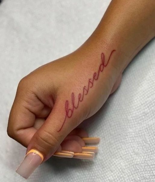 Blessed Word Tattoo In Red