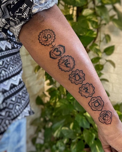 Bold Chakra Arm Tattoo