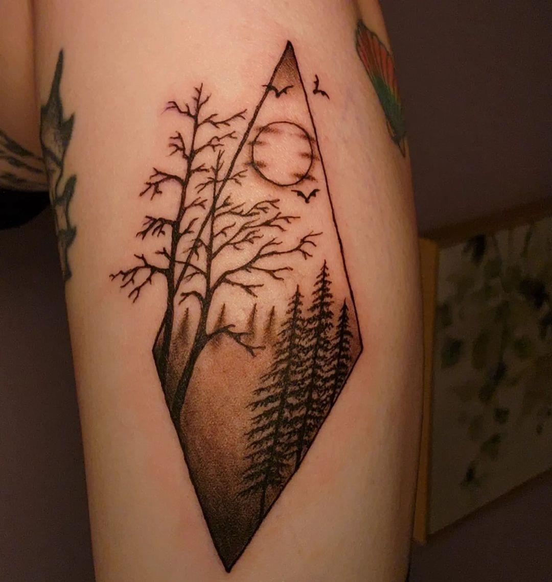 Dark Forest Tattoo On The Bicep