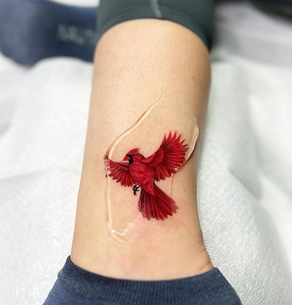 Flying Cardinal Tattoo Near The Ankle