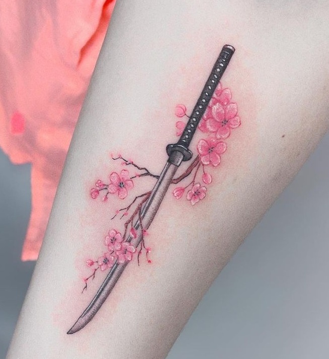 Gorgeous Sword With Flowers Tattoo