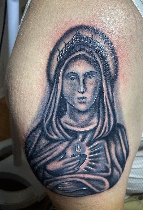 Realistic Catholic Tattoo On The Bicep