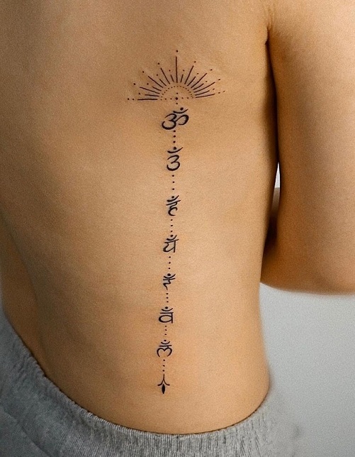 Simple Chakra Dot Tattoo On The Side Of The Ribcage