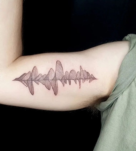 Soundwave Tattoo On The Biceps