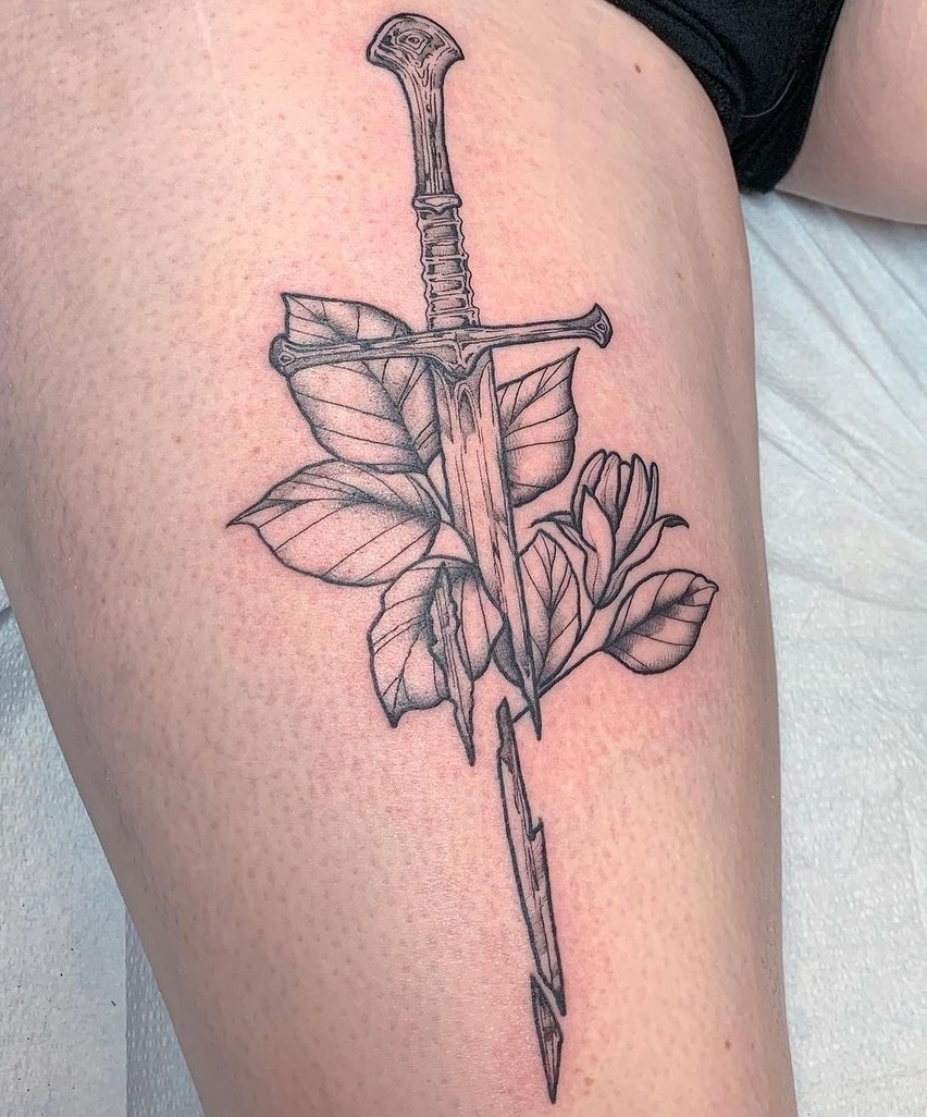 Sword Tattoo Design With Leaves And Flowers