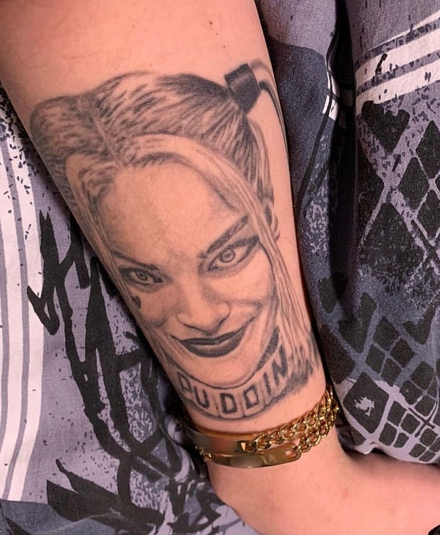 Black And White Harley Quinn Tattoo On The Lower Forearm