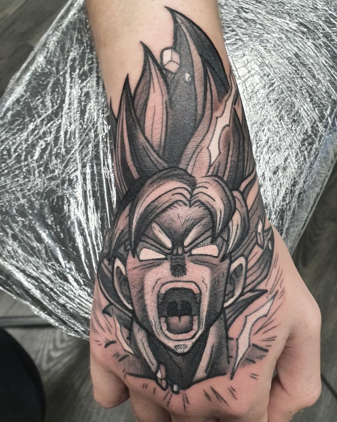 A Striking Fierce Warrior Goku Hand Tattoo