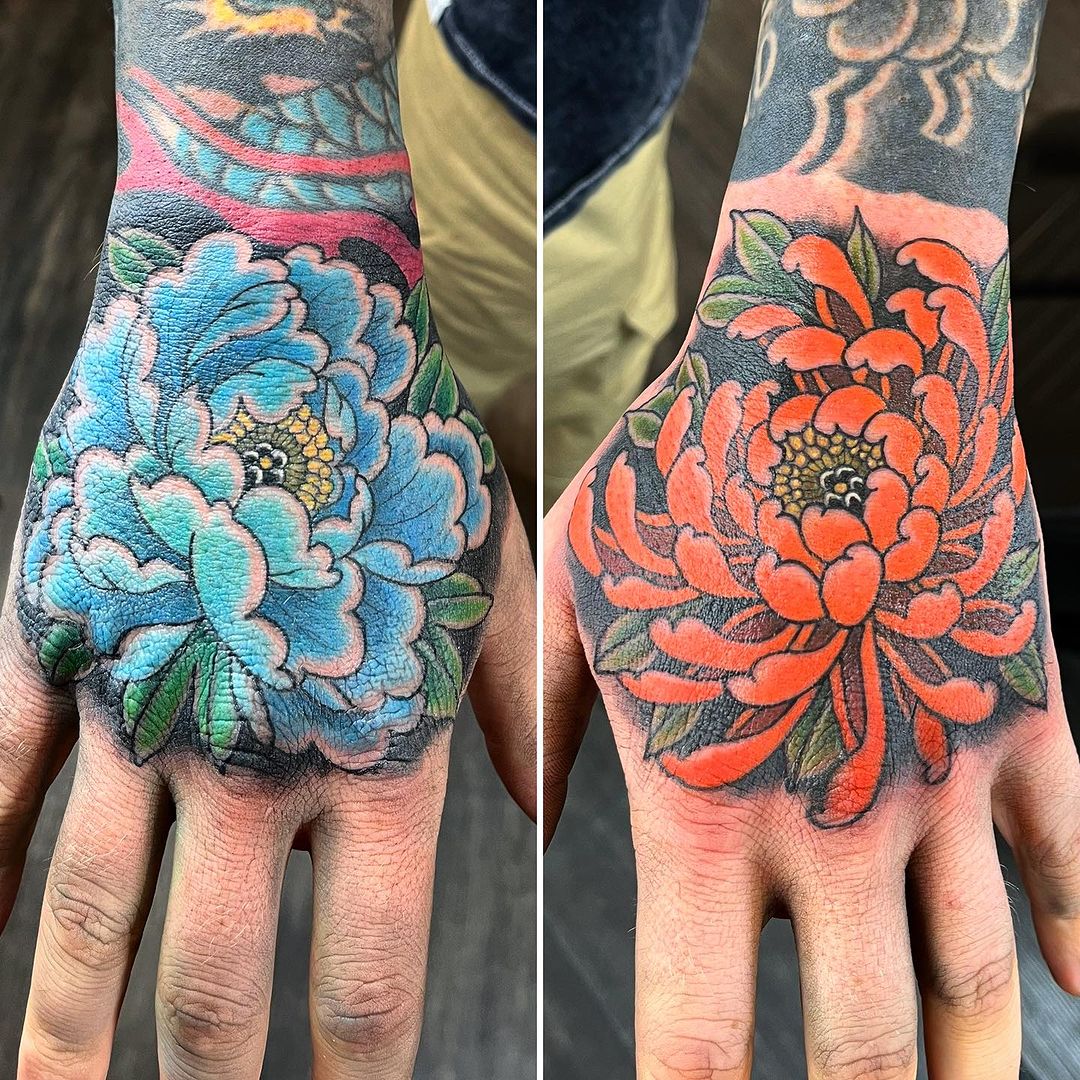 Blossoming Contrast Chrysanthemum Hand Tattoo