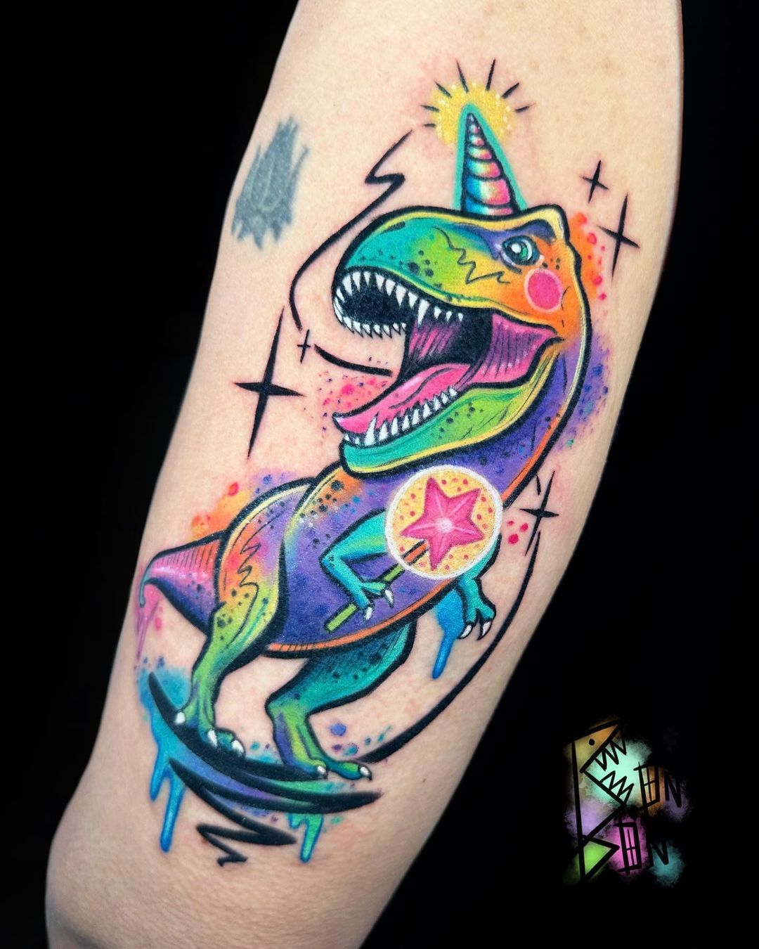 Cosmic T Rex Unicorn Forearm Tattoo