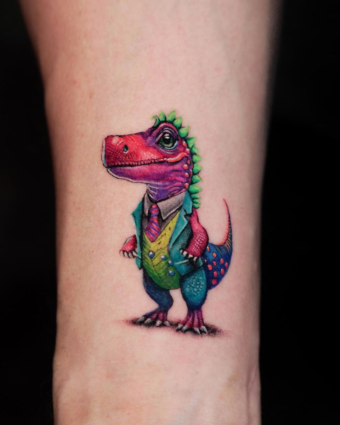 Dapper Dino Forearm Tattoo