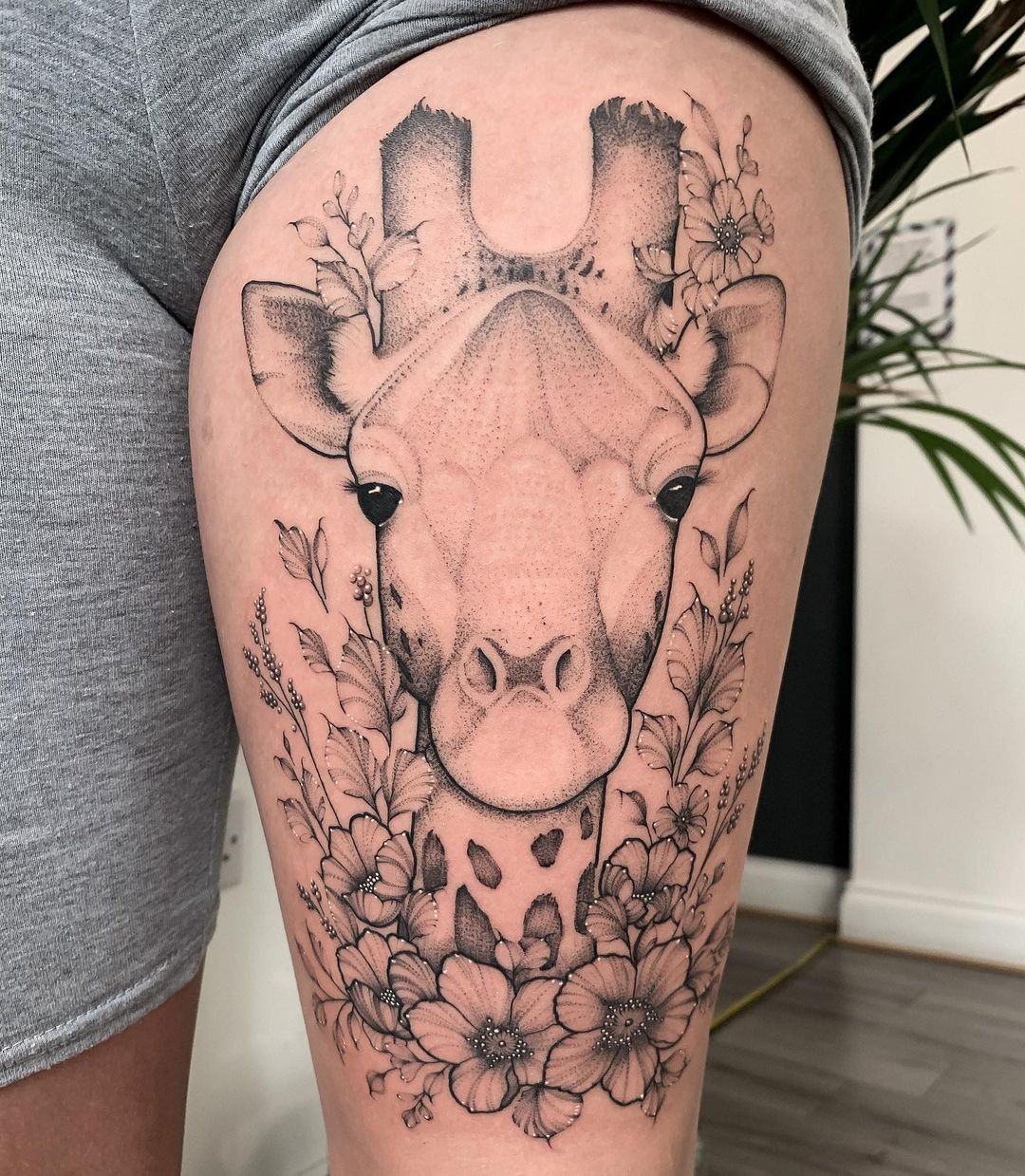 Floral Giraffe Thigh Tattoo