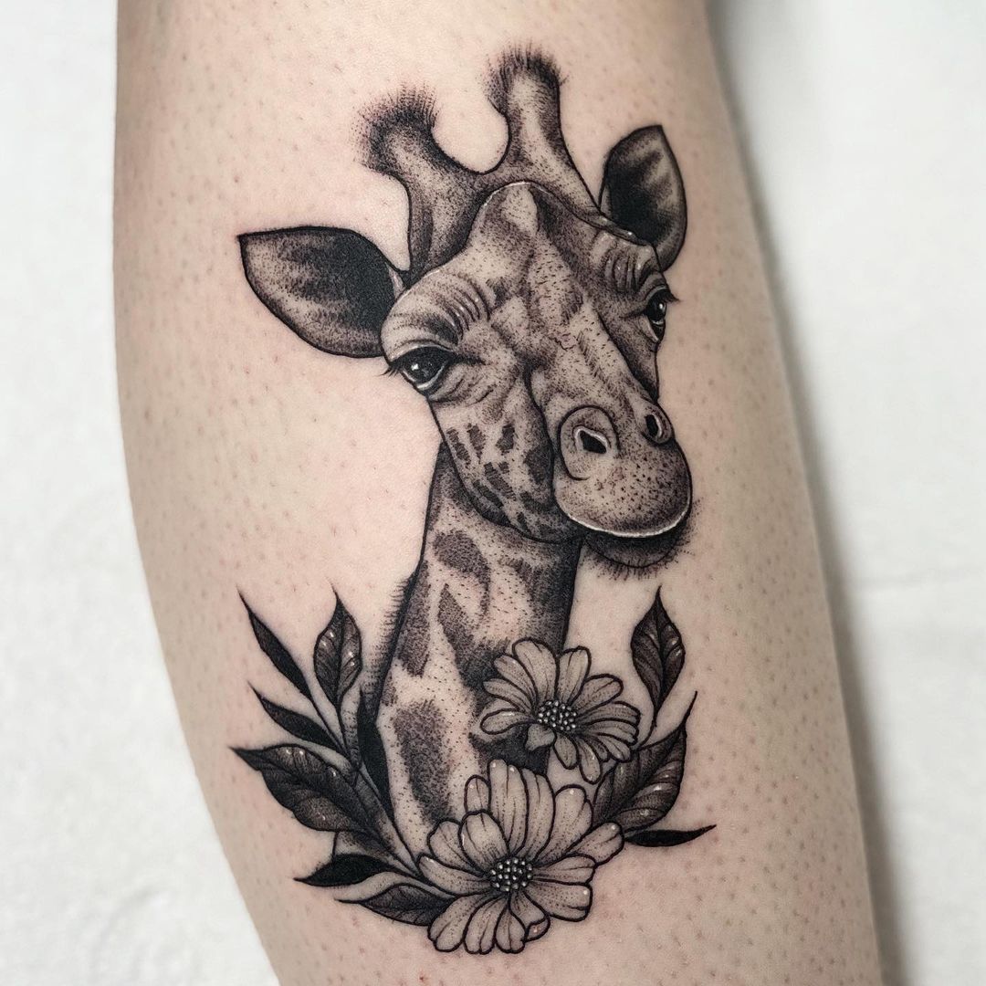 Giraffe With Flowers Leg Tattoo