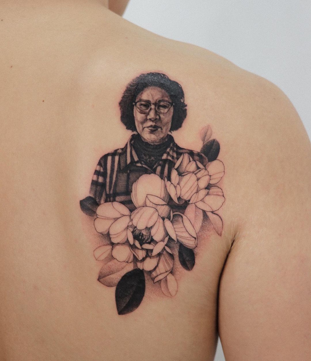 Grandmother Portrait With Flowers Tattoo
