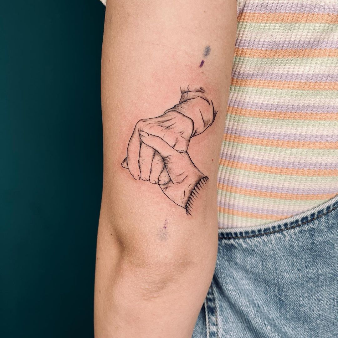 Grandmother And Grandchild Hand Holding Tattoo