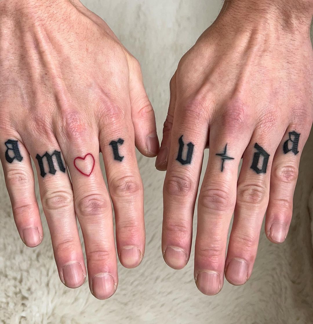 Love Conquers Knuckle Tattoos