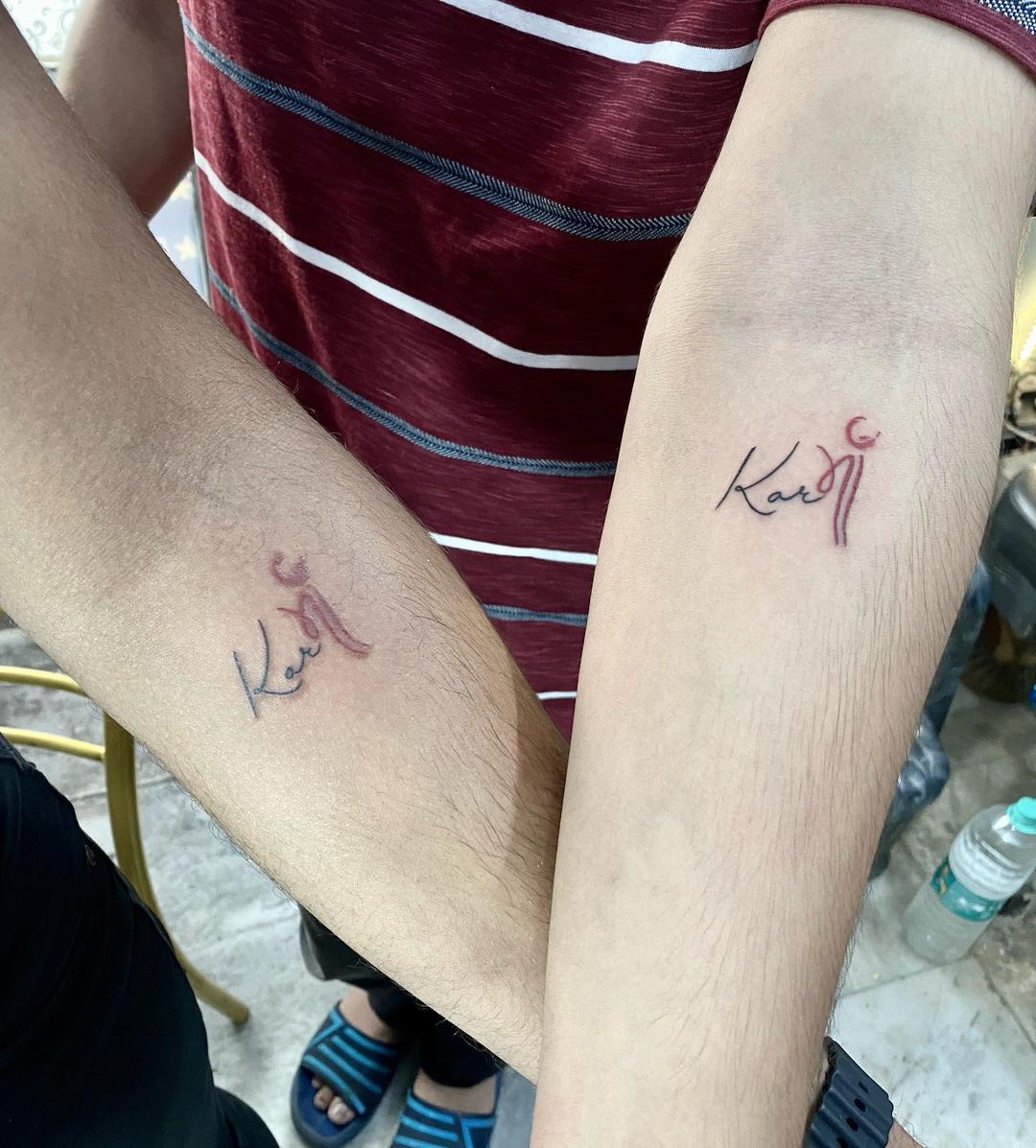 Matching Karma Script Forearm Tattoos