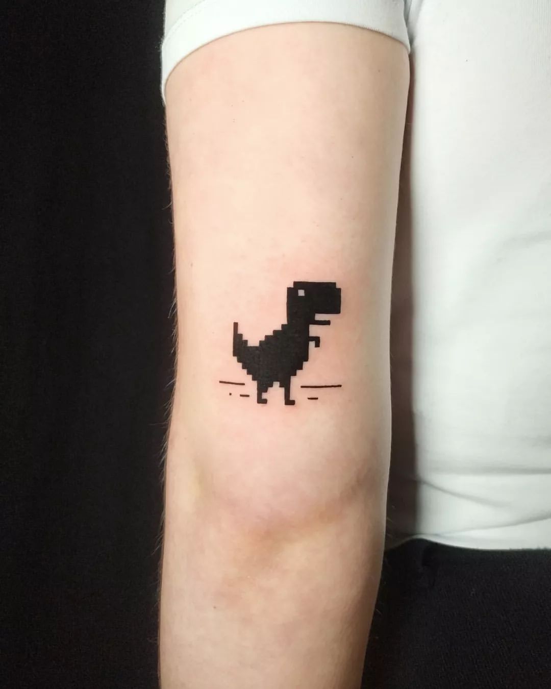 Pixelated T Rex Arm Tattoo