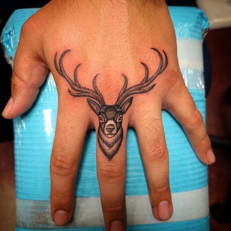 Stag Knuckle Tattoo With Soaring Antlers