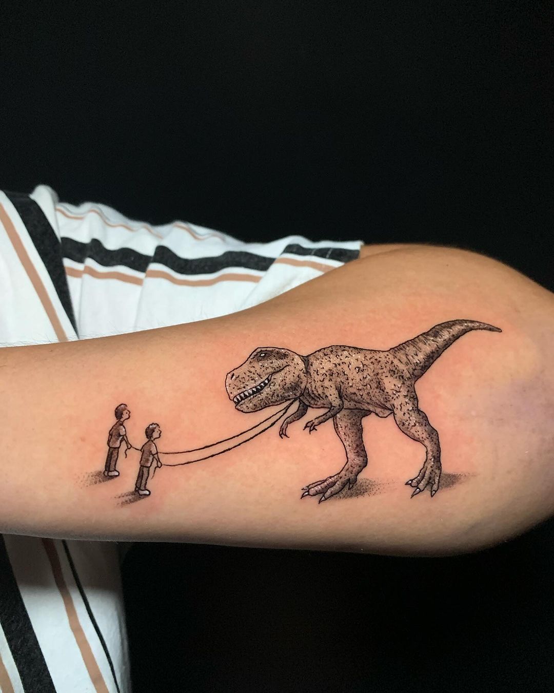 T Rex And Human Connection Forearm Tattoo